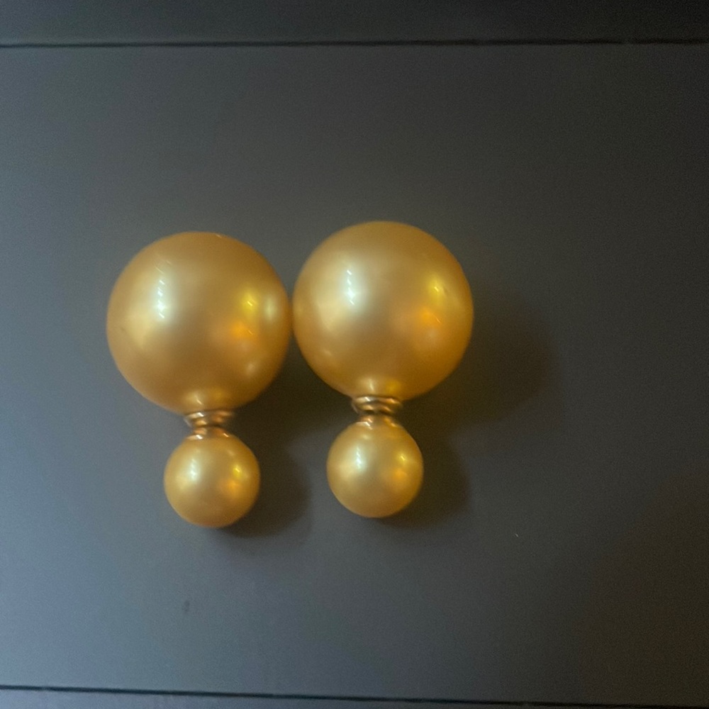 Christian Dior rose pearl earrings.
